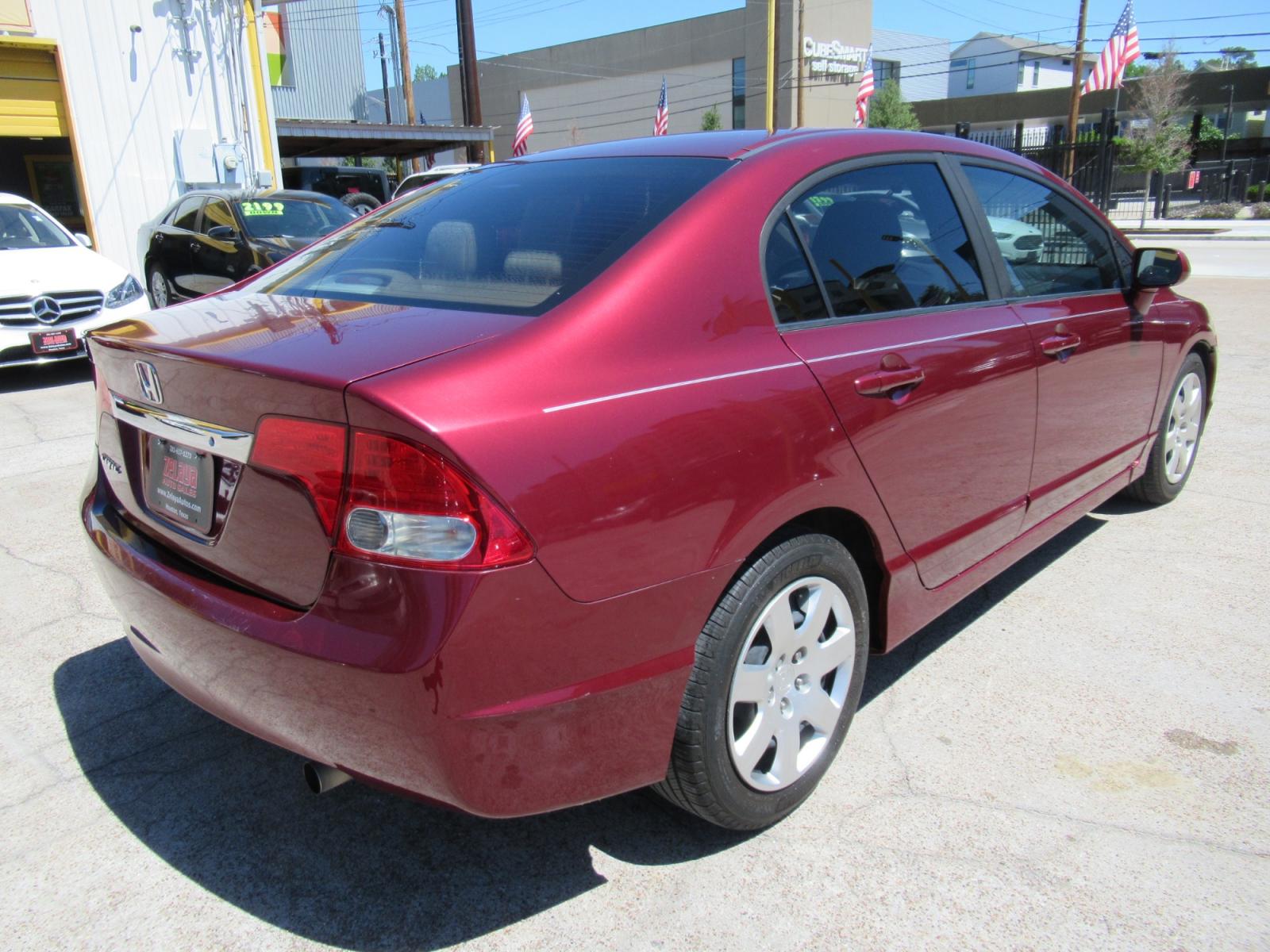 2009 Red /Tan Honda Civic LX Sedan AT (19XFA16529E) with an 1.8L L4 SOHC 16V engine, Automatic Overdrive transmission, located at 1511 North Shepherd Dr., Houston, TX, 77008, (281) 657-1221, 29.798361, -95.412560 - 2009 HONDA CIVIC LX VIN: 19XFA16529E042917 1 9 X F A 1 6 5 2 9 E 0 4 2 9 1 7 SEDAN 4 DR 1.8L I4 F SOHC 16V GASOLINE FRONT WHEEL DRIVE - Photo #16